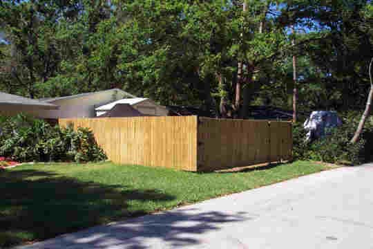 Wood or vinyl fence installation example by Kimber Landscapes